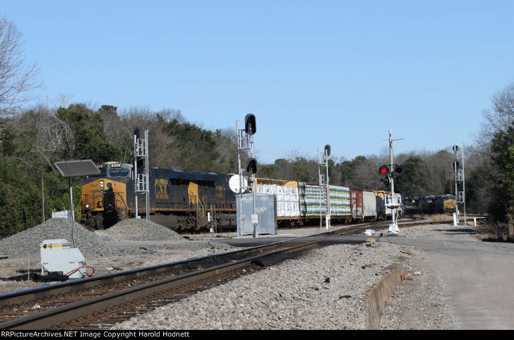 CSX 842 leads train Q492-04 out of the yard while Q491 waits
